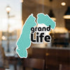 Teal abstract shape sticker with black text "grand Life" and copyright symbol.