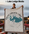 Choke Canyon Lake Texas map woven blanket with fringed edges held by a smiling man.