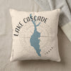 Cream pillow with blue Lake Cascade map, compass rose, and "IDAHO" text.