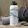 White water bottle with "STAFF LANE" text, a compass and map graphic, and copyright.