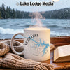 White mug with Kerr Lake map and compass design, steaming hot, by a window.