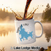 White mug with Shaver Lake, California map graphic, coffee pouring.