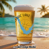Glass of beer on beach, featuring "Mystic Lake" text and California map design.