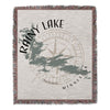 Woven blanket with Rainy Lake Minnesota map and compass design.