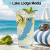 Carlyle Lake glass with mint and lime on a beach with sailboat.