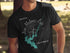 Black t-shirt with compass graphic and "New Melones Lake California" text.