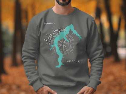 Sweatshirt featuring a teal outline of Lake Jacomo and a compass rose.