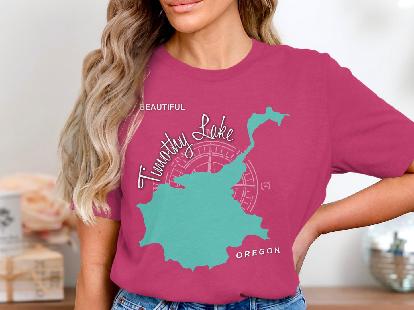 Teal outline of Timothy Lake, Oregon on a pink t-shirt.