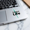 Sticker with the words "Seneca Life" and a teal wavy line across a laptop.
