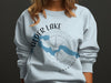Light blue sweatshirt with Alder Lake Washington map and compass design.