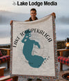 Tapestry blanket with a teal silhouette of Lake Tohopekaliga and "Florida" text.