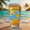 Beer glass with "Herb Parsons Lake" and blue lake shape on beach background.