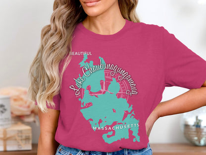Woman wearing a pink t-shirt with a teal map of Lake Chaubunagungamaug, Massachusetts.