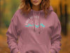 Pink hoodie with "Lake Bowen South Carolina" compass graphic and boat silhouettes.