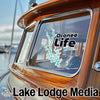 Oconee Life decal on a boat window with Lake Lodge Media text below.