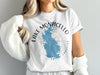 White t-shirt with blue Lake Monticello map and compass design.