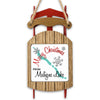 Wooden sled ornament with "Merry Christmas from Maligne Lake" text and snowflakes.