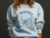 Light blue sweatshirt with "Lake Wedowee Alabama" text, a compass, and lake outline.
