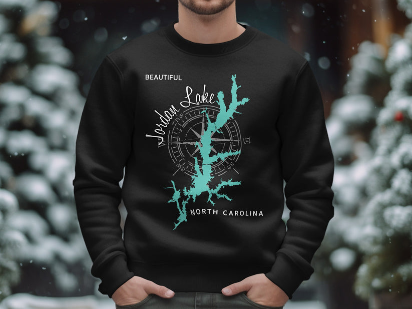 Black sweatshirt with turquoise Jordan Lake map and compass design.