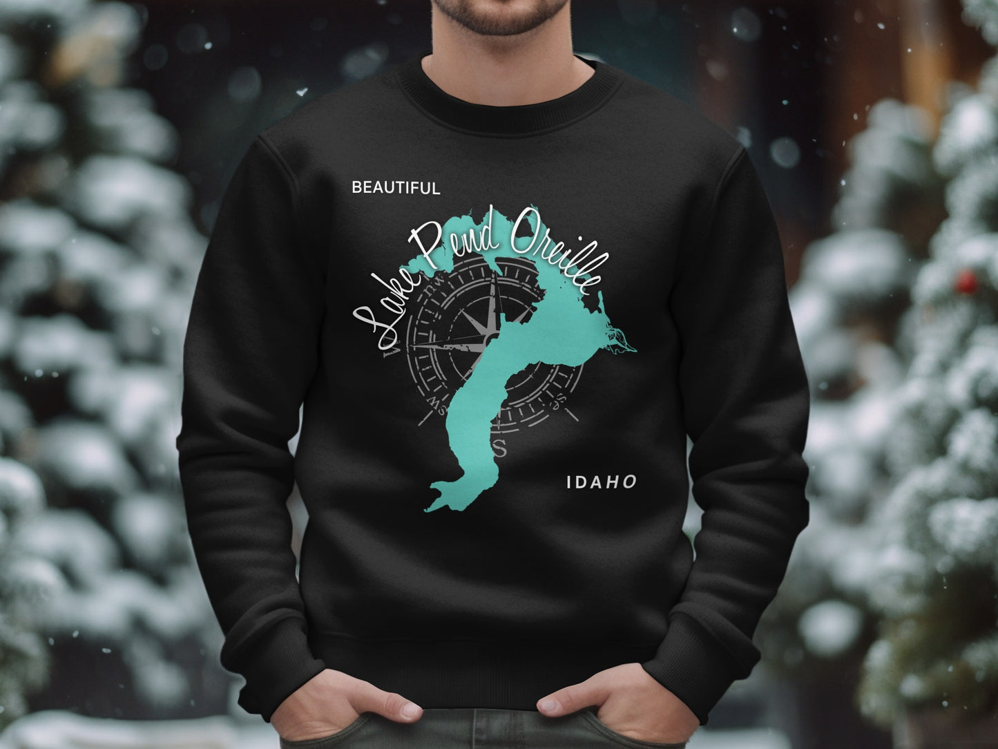 Black sweatshirt with a teal Lake Pend Oreille map and compass design.