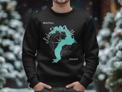 Black sweatshirt with a teal Lake Pend Oreille map and compass design.