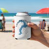 White koozie with blue Lake Pend Oreille map and compass, held on a beach.