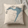 Cream pillow with Rushford Lake map and compass design.