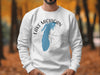 White sweatshirt with blue Lake Michigan outline and compass graphic.