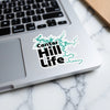 Center Hill Life sticker with teal lake outlines on a laptop.