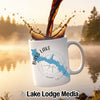 White mug with "Bass Lake California" map design, coffee pouring into it.