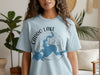 Light blue t-shirt with Caddo Lake Texas map and compass design.