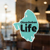 Turquoise Okeechobee Life sticker with black text on clear window.