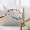 Pillow with compass and Woods Canyon Lake Arizona graphic on light fabric.