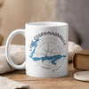 White mug with blue Lake Ossawinnamakee map and compass graphic.