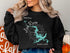 Black sweatshirt with compass rose and Loch Raven Maryland graphic.