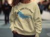 Light yellow sweatshirt with "Lake Kabetogama Minnesota" and compass graphic.
