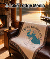 Choke Canyon Lake Texas map and compass throw blanket on leather sofa.