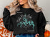 Black sweatshirt with a compass and map of Table Rock Lake, Missouri.