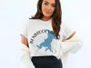 White t-shirt with Benbrook Lake, Texas map and compass graphic.