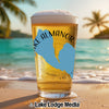 Glass of beer on a beach with Lake Almanor outline and "California" text.