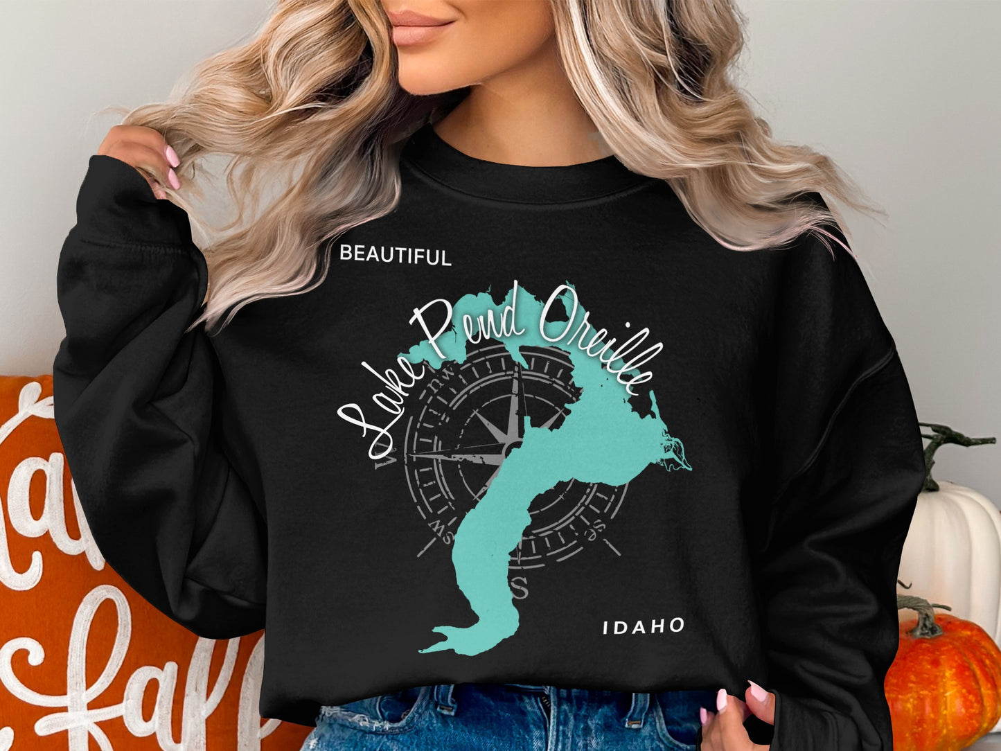 Black sweatshirt with teal Pend Oreille lake map and compass.