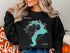 Black sweatshirt with teal Pend Oreille lake map and compass.