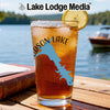 Glass with iced tea, lemon, and lake outline with compass rose design.