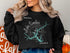 Black sweatshirt with "Beautiful Lake Sinclair Georgia" text and map design.