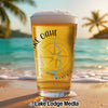 Glass of beer on beach with "Lake OAHE" text and compass graphic.