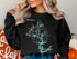 Black sweatshirt with "Beautiful Norfork Lake Arkansas" and compass design.