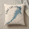 Cream pillow with blue Lake Las Vegas outline and compass rose graphic.