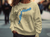 Cream sweatshirt with Baker Lake Washington map and compass graphic.