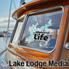 Allatoona Life sticker on a wooden boat window with Lake Lodge Media logo.