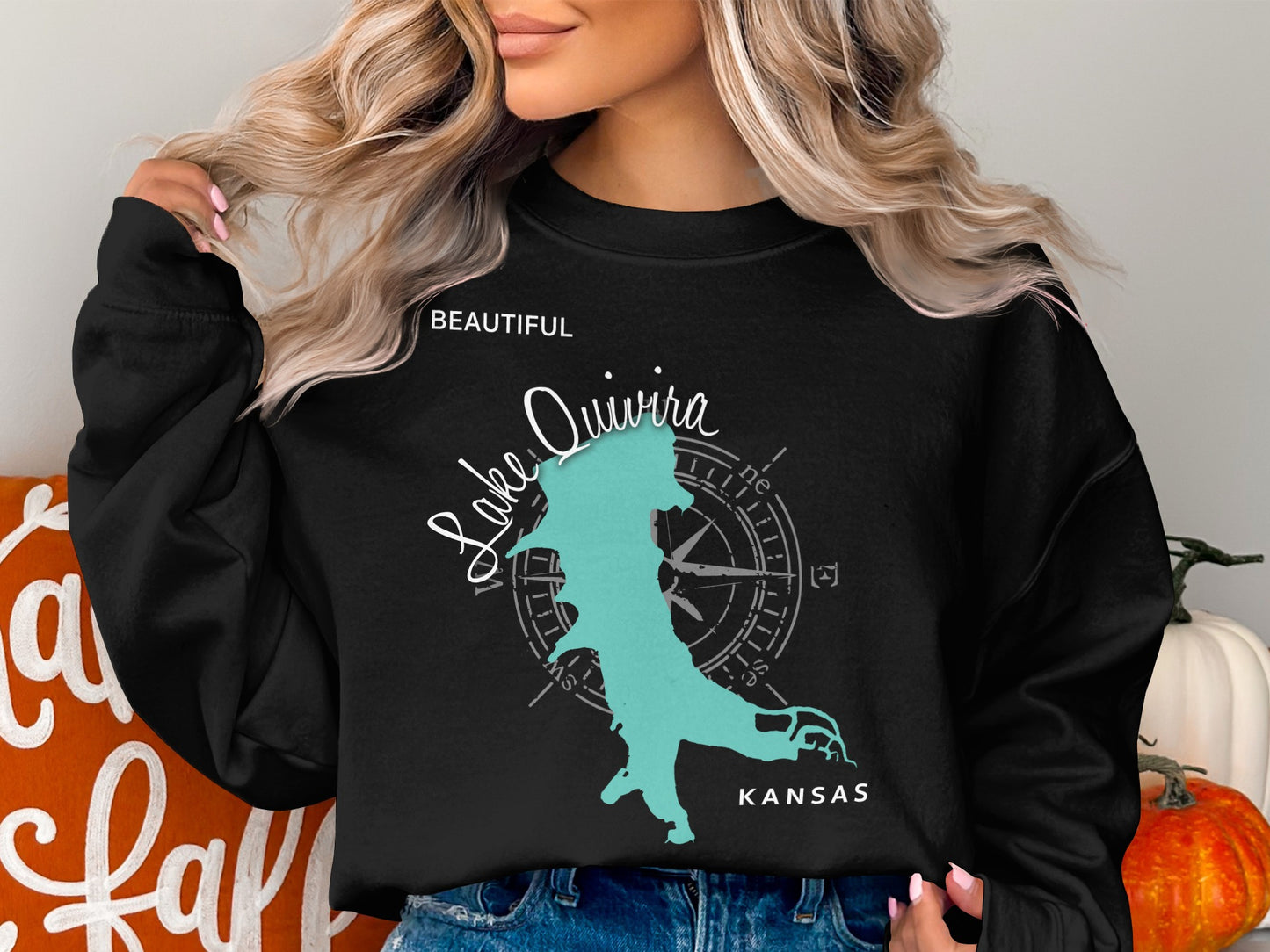 Black sweatshirt with turquoise Lake Quivira, Kansas map and compass graphic.